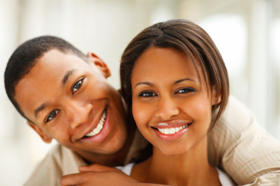 Closeup portrait of a romantic happy young African American couple